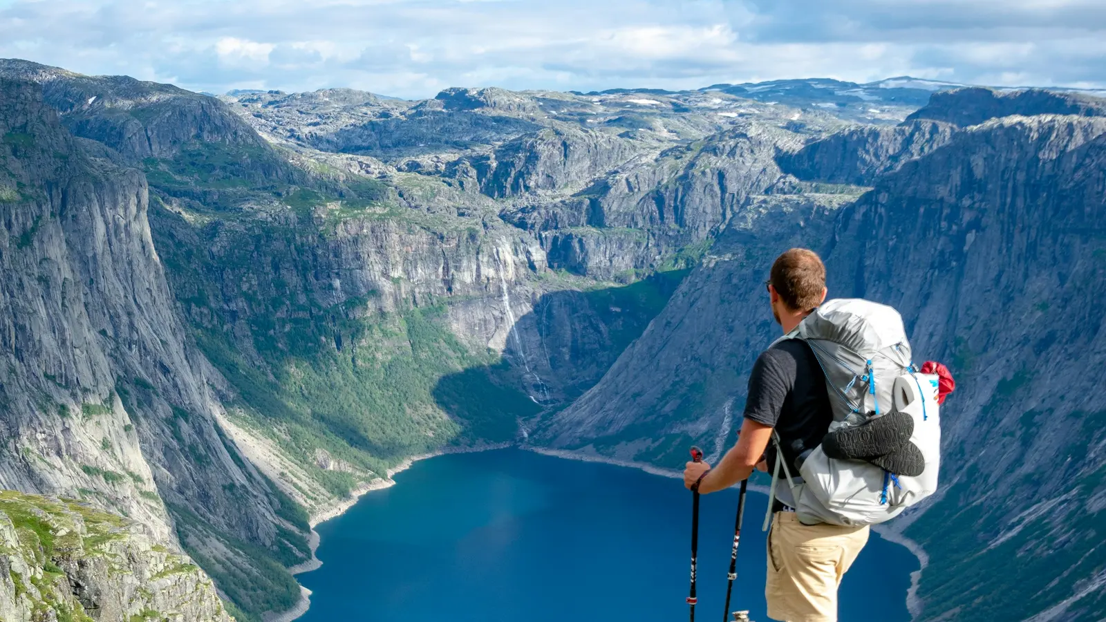 Man writing a dating profile inspired by a real hiking trip, illustrating specific stories over generic adjectives