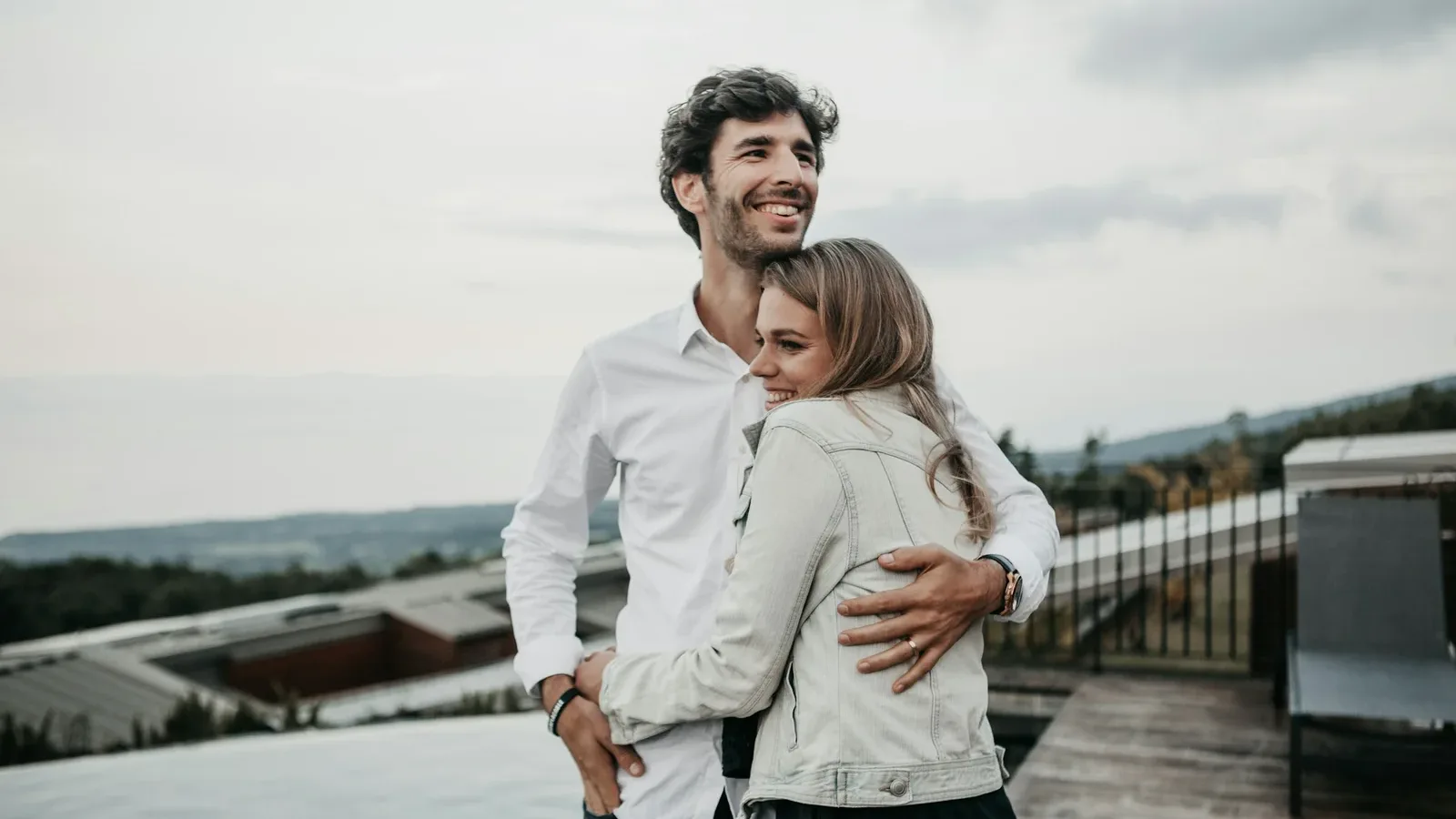 Couple enjoying a private conversation on a rooftop terrace