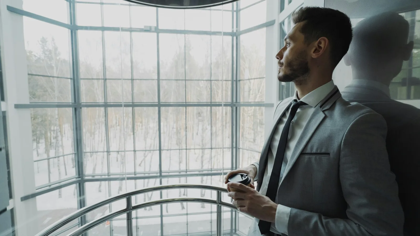 Successful, thoughtful professional man pausing to reflect, illustrating why successful men struggle to date